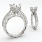features a beautiful floral oval tiara on a straight shank adorned with round brilliant diamonds. The inner profile embodies a gorgeous half diamond Riviera along with our