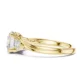 three stone for 2 carat engagement ring in yellow gold with round side diamonds and elegant curved band
