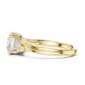 three stone for 2 carat engagement ring in yellow gold with round side diamonds and elegant curved band